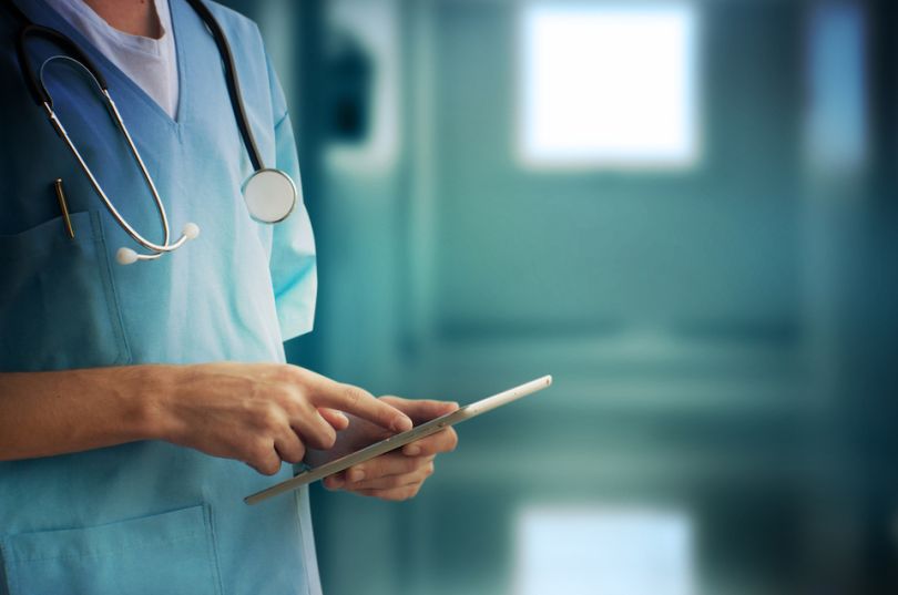 Doctor uses tablet in a hospital