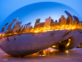 Chicago Cloud Gate shows reflection of the city at night.